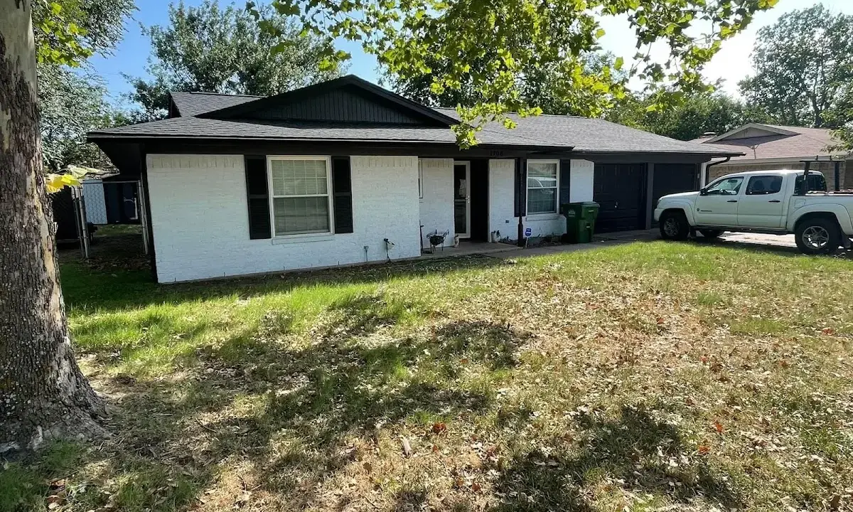 Professional roofing crew working on a residential roof in Lake Monticello